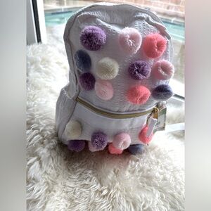 Kids backpack with golden hardware.